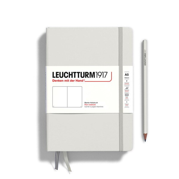 A light gray hardcover notebook.